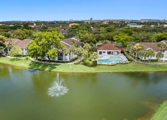 apartment community with a lake in the center