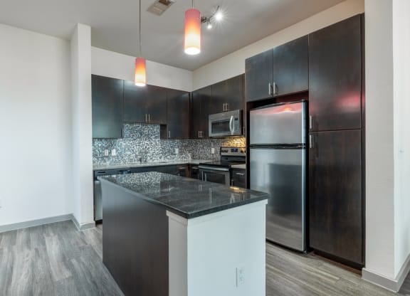 a kitchen with stainless steel appliances and a counter top