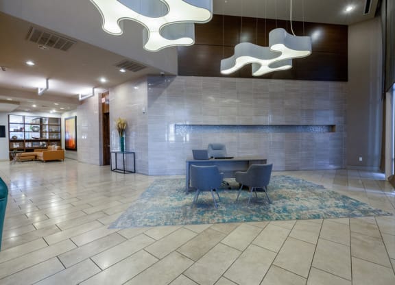 a conference room with a table and chairs in a lobby