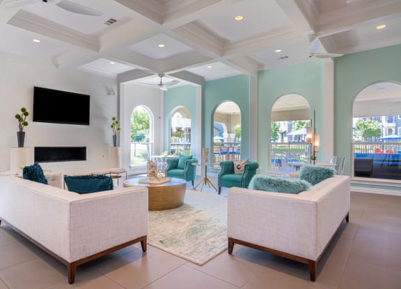 Resident clubhouse common area with couches and television