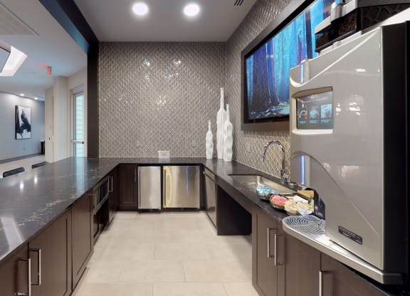 Clubhouse kitchen area with coffee machine and long bar area