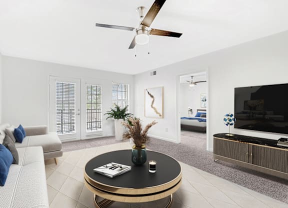 Living Room With TV at Caveness Farms Apartments, North Carolina, 27587