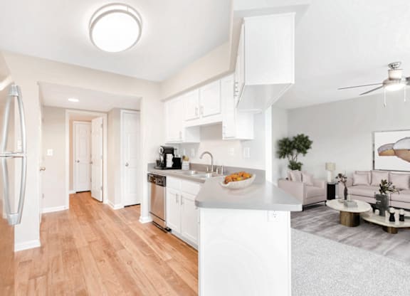 a kitchen and living room at Caveness Farms Apartments, Wake Forest, NC 