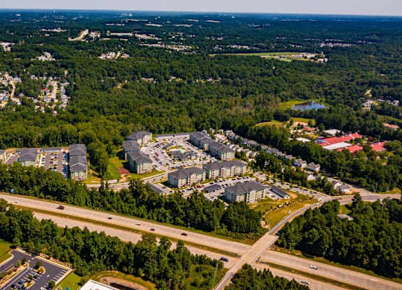 An aerial view of a suburban area with roads and buildings at Foxwood Apartments, Raleigh-Durham