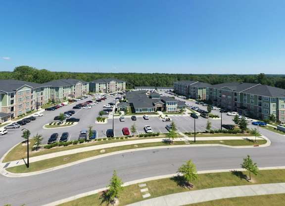 A large parking lot is surrounded by apartment buildings at Foxwood Apartments, Raleigh-Durham, NC