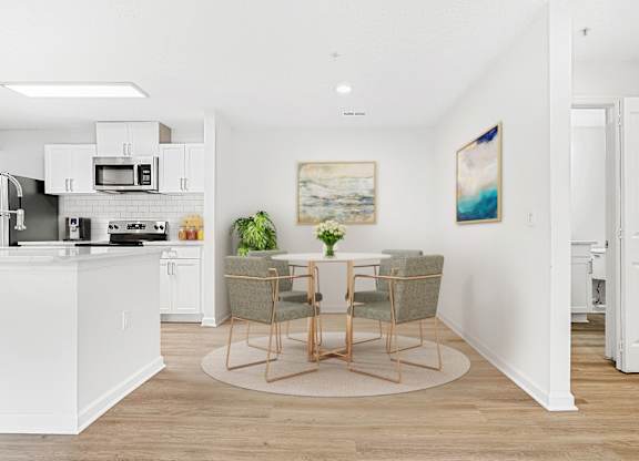 A kitchen with a dining table and chairs. at The Grayson Apartment Homes, Charlotte, NC, 28262