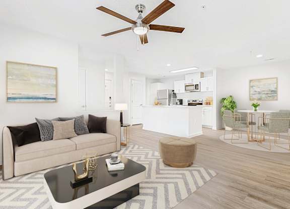 A living room with a beige couch, a coffee table, and a ceiling fan. at The Grayson Apartment Homes, Charlotte, 28262