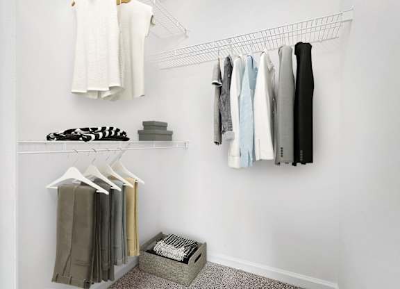 Closet With Clothes at The Grayson Apartment Homes, North Carolina