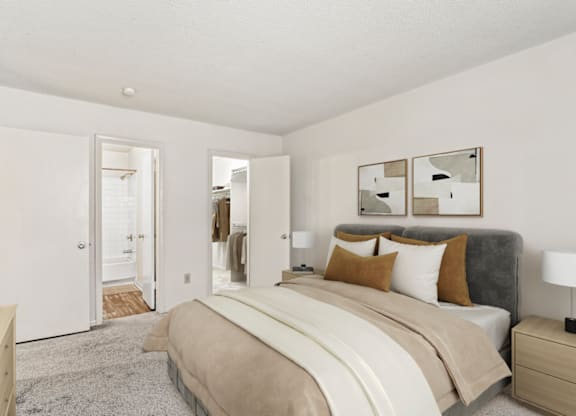 a bedroom with a large bed and white walls at Eastchester Ridge Apartments, High Point, North Carolina