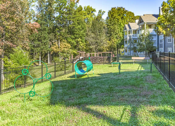 our apartments showcase a dog park with a playground