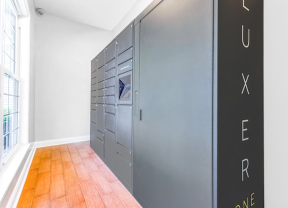 a row of lockers in a room with a large window