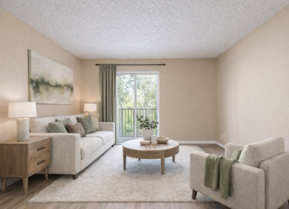 A living room with a couch, a chair, a coffee table, and a painting on the wall.