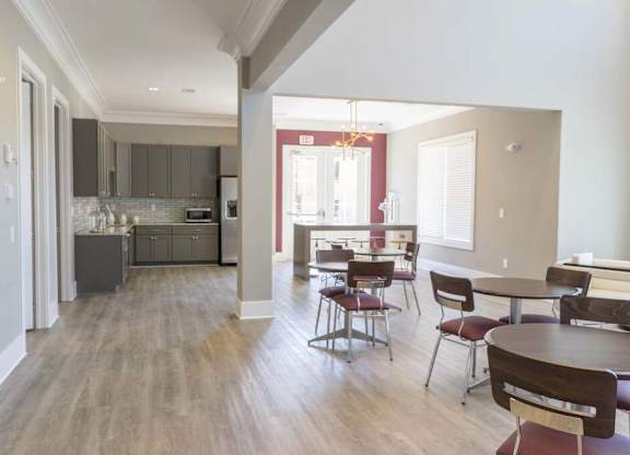 A kitchen with a dining table and chairs at Foxwood Apartments, Raleigh-Durham, North Carolina