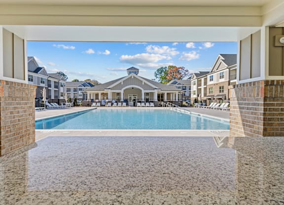 A view of a pool from a covered area at Litchford 315 Apartments, North Carolina, 27615
