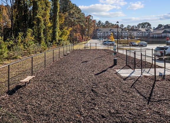 A baseball field with a fence and a bench at Litchford 315 Apartments, Raleigh, 27615