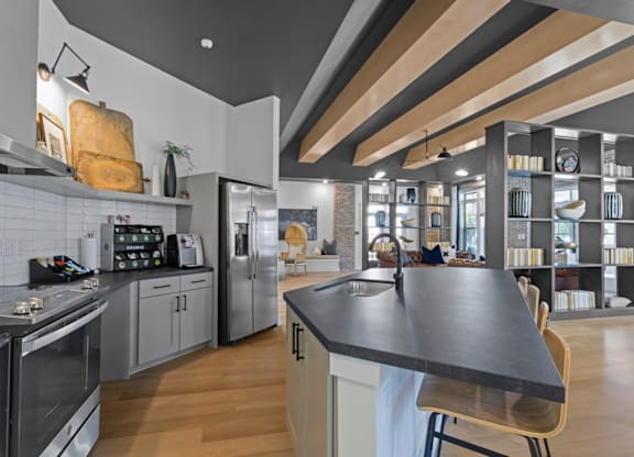 A modern kitchen with a large island in the center at Litchford 315 Apartments, North Carolina, 27615