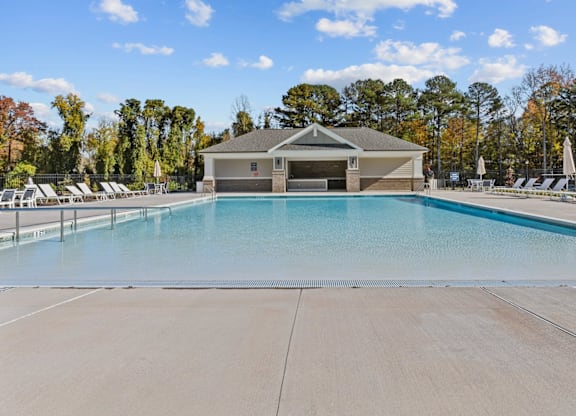 A large swimming pool with a building in the background at Litchford 315 Apartments, Raleigh, NC, 27615