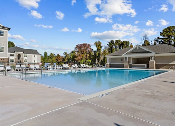 A large swimming pool in a sunny outdoor setting at Litchford 315 Apartments, Raleigh, North Carolina