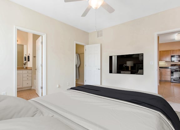 staged bedroom with carpeted flooring and ceiling fan at Ashley Court Apartments, North Carolina, 28262