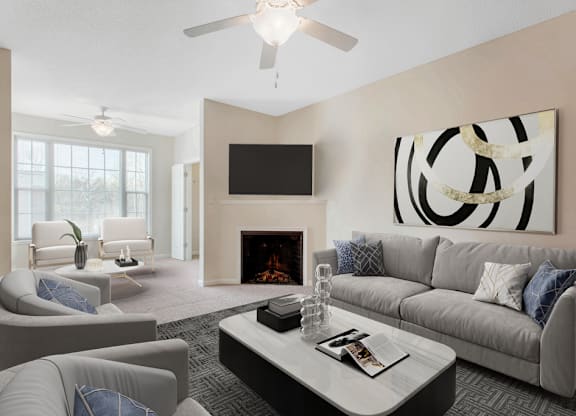 staged living room with carpeted flooring, ceiling fan, and fireplace at Ashley Court Apartments, Charlotte, 28262