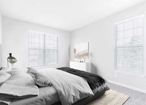 A bedroom with a large bed and a painting on the wall.