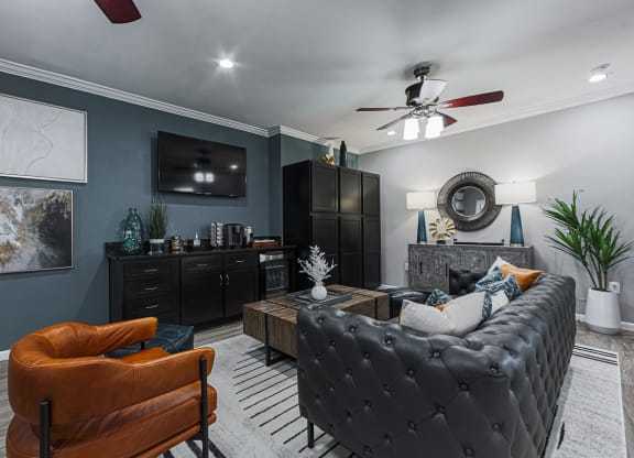 clubhouse with leather furniture and a tv
