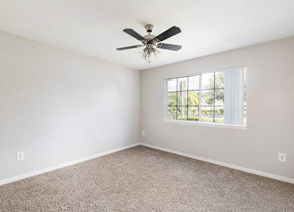 bedroom with carpeted flooring and a ceiling fan