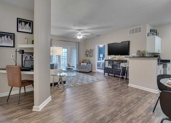 A living room with wood style flooring