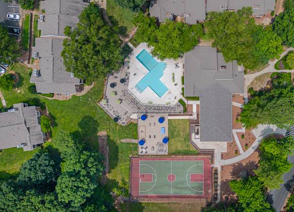 An aerial view of a basketball court and a basketball hoop.