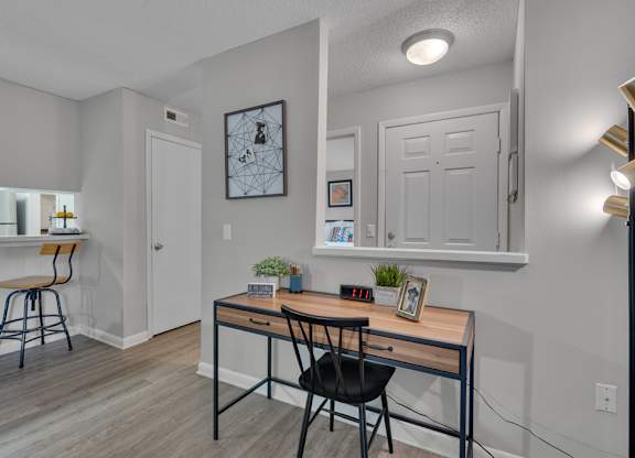 A room with a desk and a chair.
