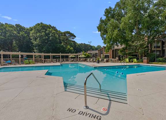 A pool with a no diving sign painted on the ground.