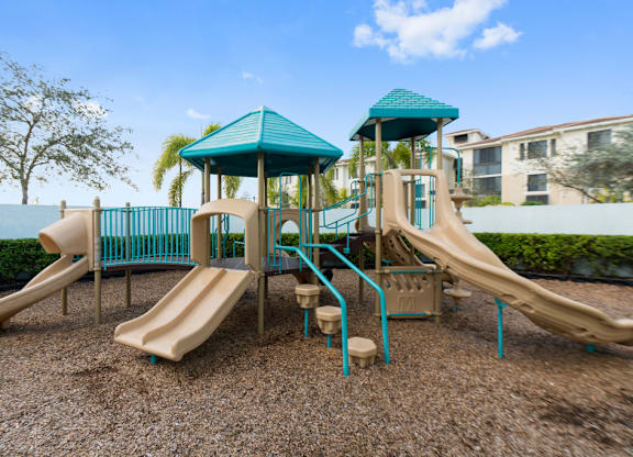 A playground with a blue roof and a slide.