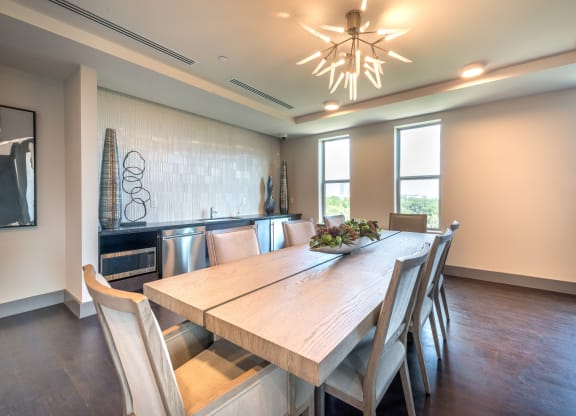 Resident conference area facing a refrigerator and decorative lighting