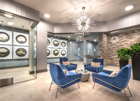 Resident sitting area inside the sky lounge facing decorative lighting.