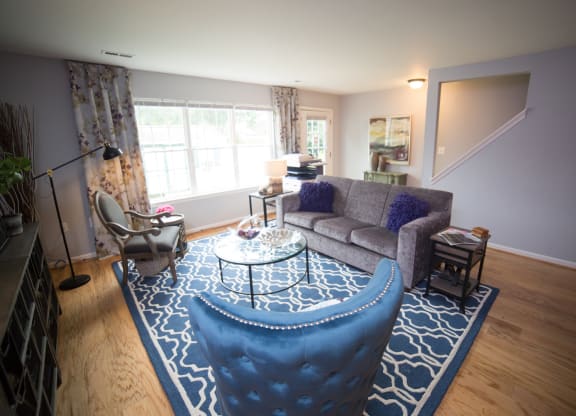 Livingroom with sofa, coffee table and arm chair.