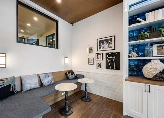 a living room with a couch and two tables