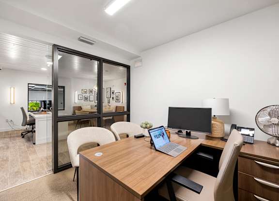 a home office with a desk and a computer