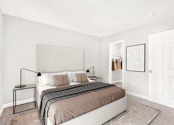 A bedroom with a bed, nightstand, and a framed picture on the wall at Paces Pointe Apartment Homes, Matthews, 28105