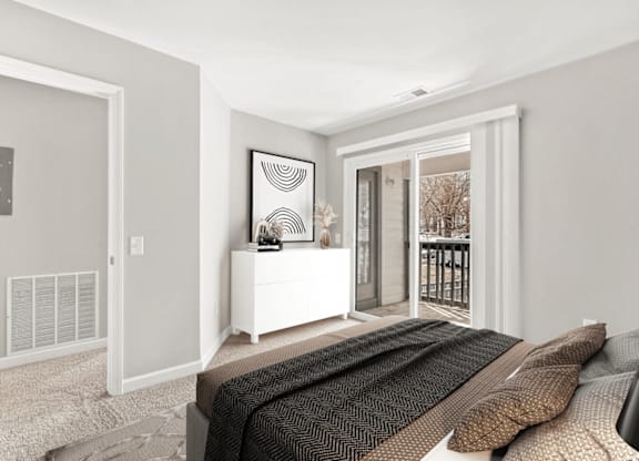 A bedroom with a bed, a dresser, and a window at Paces Pointe Apartment Homes, Matthews