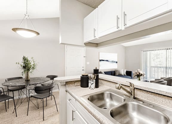 A kitchen with a table and chairs at Paces Pointe Apartment Homes, North Carolina