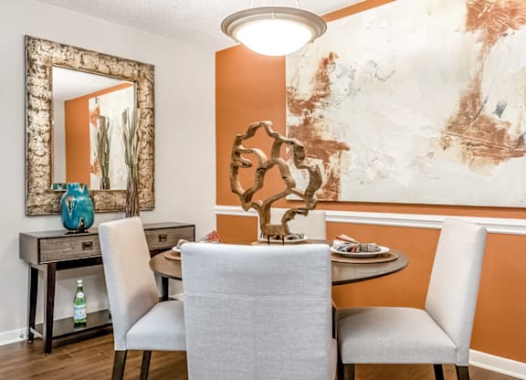 A dining room with a table and chairs at Paces Pointe Apartment Homes, Matthews, North Carolina