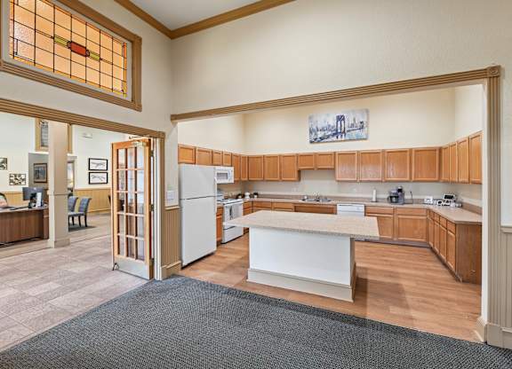 leasing kitchen with wooden cabinets and a white island.
