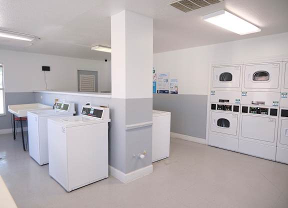 A laundromat with washers and dryers.