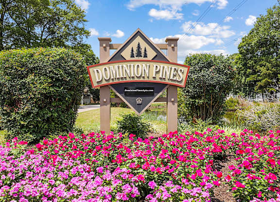 Property sign with flowers in front