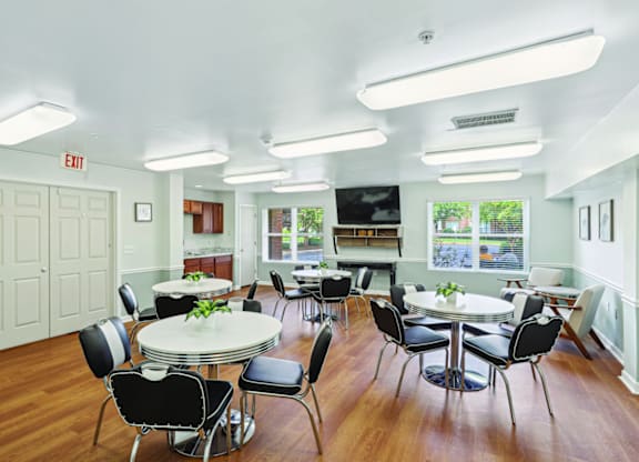A white room with a table and chairs.