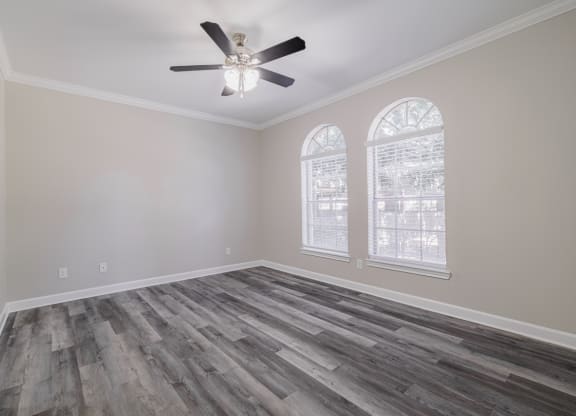 living room with hardwood-style flooring and ceiling fan