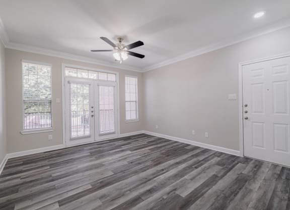 living room with hardwood-style flooring and ceiling fan