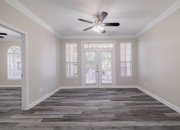 living room with hardwood-style flooring and ceiling fan
