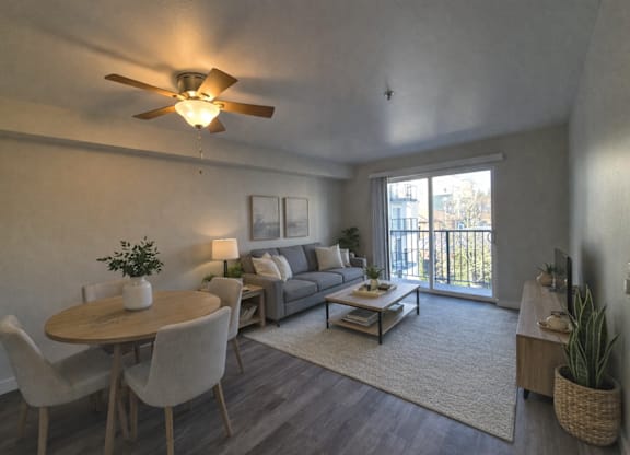 A living room with a dining table and chairs.