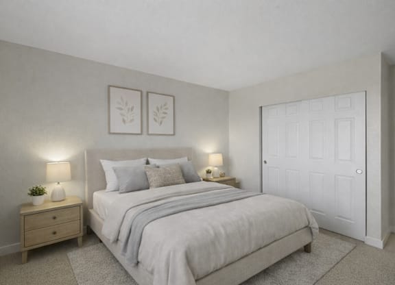 A bedroom with a bed, nightstand, and two wall lamps.